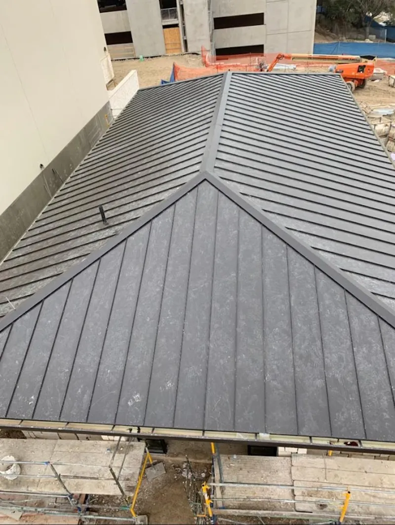 Commercial metal roof construction with crane equipment in Diamond Bar